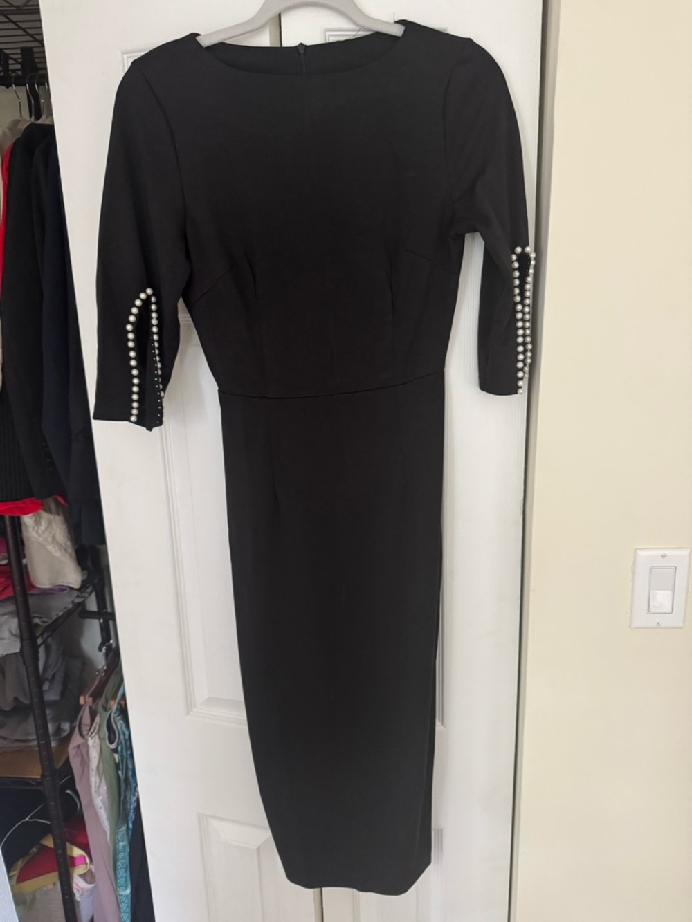 Elegant Black Midi Dress with Pearl-Embellished Sleeves